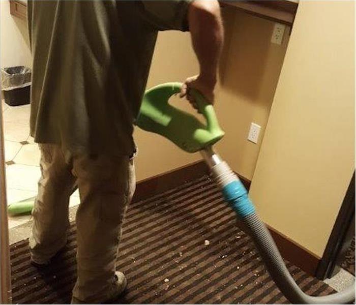 A specialist removing water damage of a business